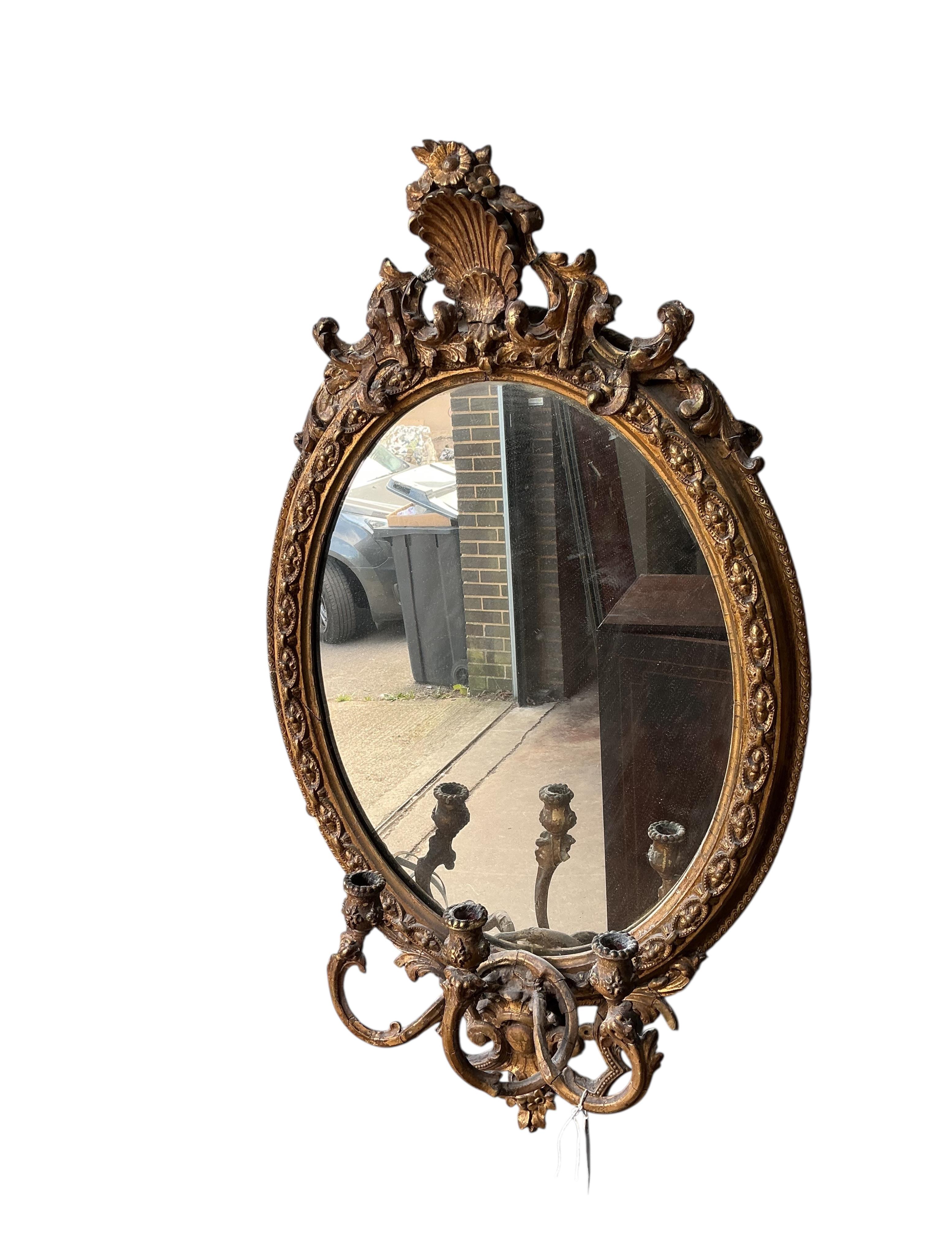 A Victorian giltwood and composition girandole wall mirror, width 56cm, height 96cm